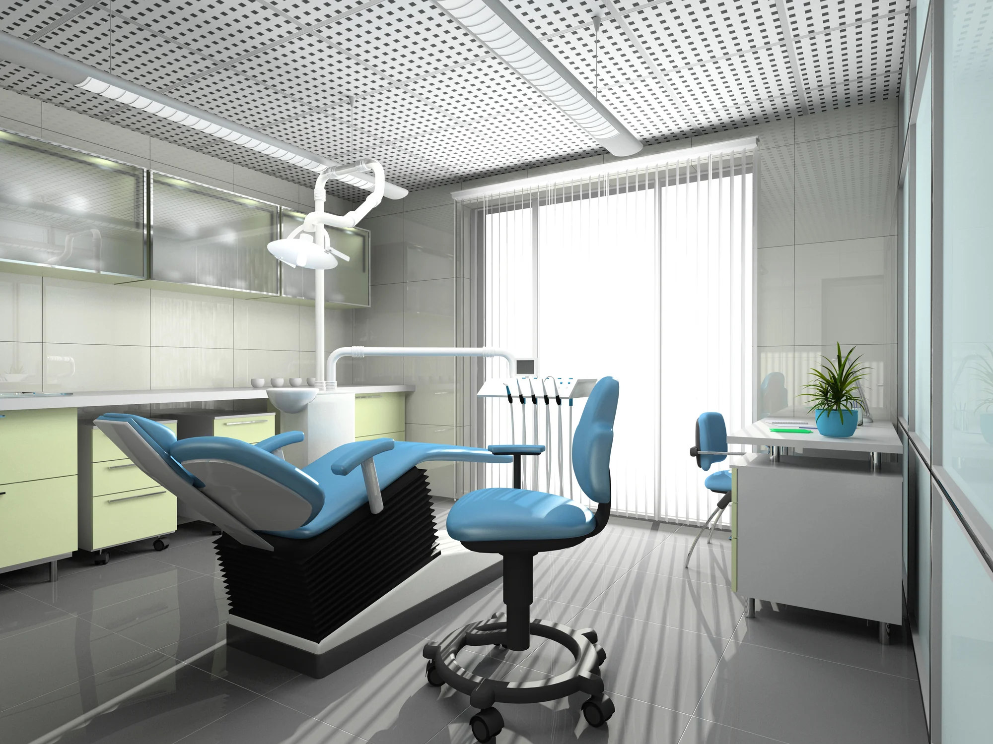 A bright dental treatment room with a blue dental chair